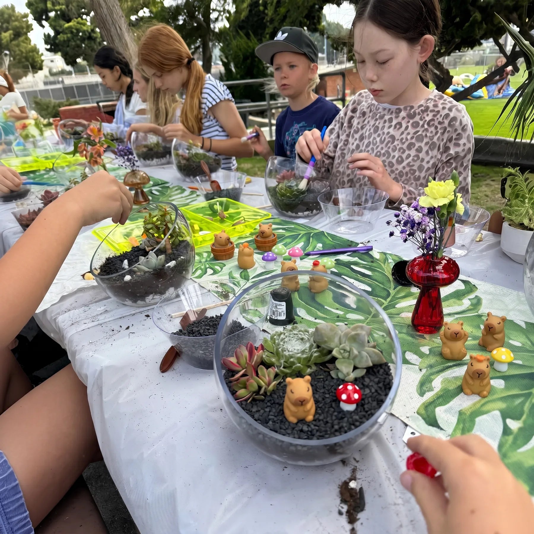 Mobile terrarium birthday party workshop for kids in Los Angeles, featuring succulent planting, creative decorating, and hands-on fun.